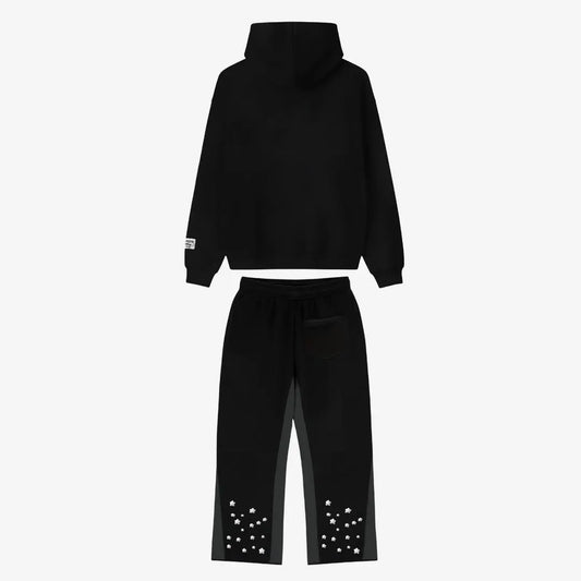 Back view of the full CELESTIC Black Star Tracksuit set laid flat on a white background. This premium heavyweight black cotton fleece ensemble features an oversized hoodie with a structured hood and matching relaxed straight-leg sweatpants with multiple white embroidered stars scattered around the back leg openings.