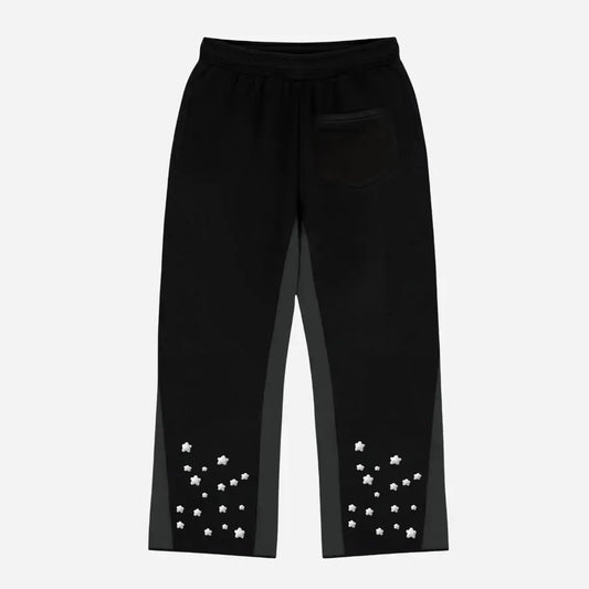 Back view flat-lay photograph of the CELESTIC Black Star Pants on a white background. These premium heavyweight black cotton fleece sweatpants feature a relaxed straight-leg fit, a single right back pocket, and contrasting grey side panels. The lower back legs are detailed with multiple scattered white embroidered stars.