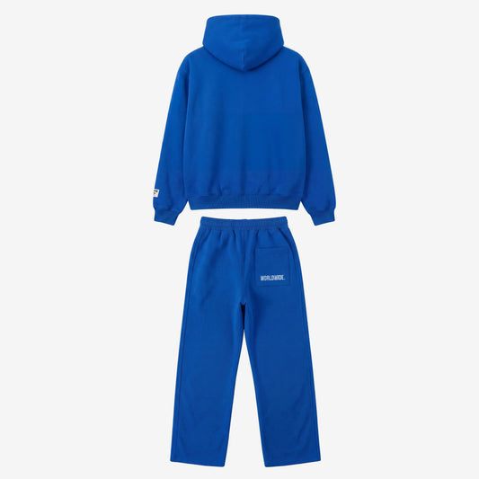 Back view of the CELESTIC Blue Basic Tracksuit laid flat on a white background. Premium heavyweight blue cotton fleece set showing a clean minimalist hoodie back, structured hood, and matching sweatpants featuring white 'WORLDWIDE' embroidery on the back pocket.