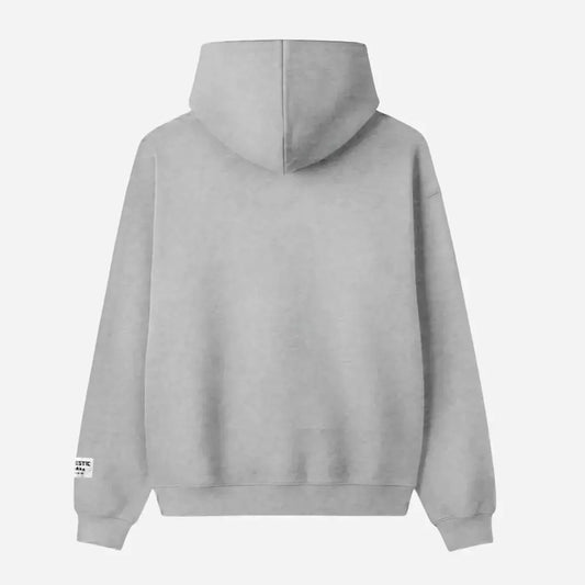 Back view flat-lay photograph of the CELESTIC Grey Star Hoodie on a white background. This premium heather grey cotton fleece pullover features a clean minimalist back design, a structured double-lined hood, and ribbed cuffs and hem. A distinct white woven CELESTIC brand patch is visible on the left sleeve cuff.