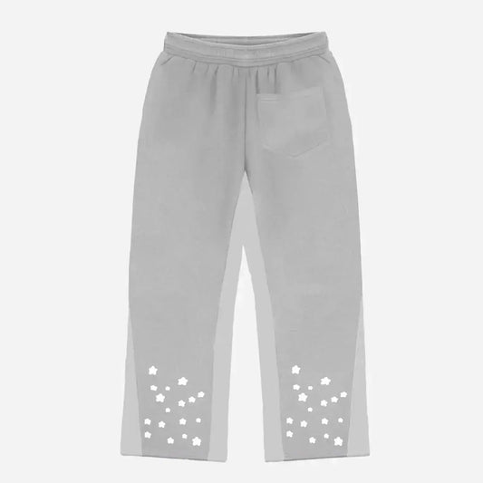 Back view flat-lay photograph of the CELESTIC Grey Star Pants on a white background. These premium heather grey cotton fleece sweatpants feature light grey side panels, a relaxed fit, and a single back pocket on the right side. The lower back of both legs is detailed with multiple scattered white embroidered stars, highlighting the unique streetwear aesthetic of the Star collection.