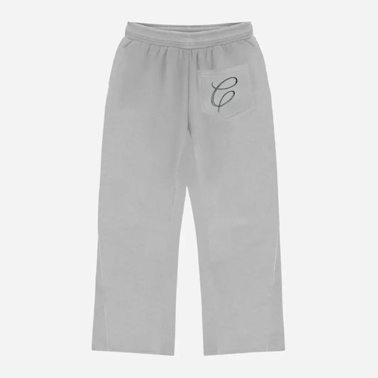 Back view flat-lay photograph of the CELESTIC Grey Zipper Flared Pants on a white background. These premium heather grey cotton fleece sweatpants feature a relaxed flared-leg fit and a single right back pocket detailed with an elegant black embroidered 'C' script logo. The image showcases the high-quality stitching and the wide, flared leg silhouette from the rear.