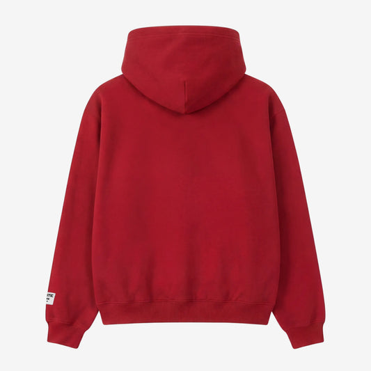 Back view flat-lay photograph of the CELESTIC Red Gemstone Hoodie on a white background. This premium vibrant red cotton fleece pullover features a clean, minimalist back design without graphics, a structured double-lined hood, and ribbed cuffs and hem. A distinct woven CELESTIC brand patch with white text is visible on the left sleeve cuff.