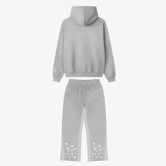 Back view flat-lay photograph of the CELESTIC Grey Star Tracksuit on a white background. The set includes a premium heather grey pullover hoodie with a structured hood and a matching pair of sweatpants. The sweatpants feature light grey side panels and a single back pocket on the right. Both legs are detailed with multiple scattered white embroidered stars on the lower back portion. A woven brand patch is visible on the hoodie's left sleeve.