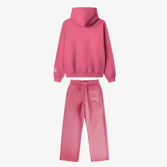Back view of the Celestic Pink Basic Tracksuit. Premium pink heavyweight oversized hoodie and matching sweatpants set, featuring white WORLDWIDE embroidery on the back pocket of the joggers.