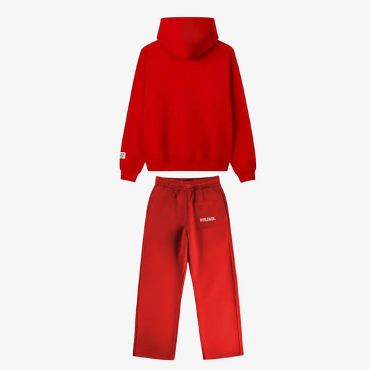 Back view of the CELESTIC Red Basic Tracksuit laid flat on a white background. Premium heavyweight red cotton fleece set showing a clean minimalist hoodie back, structured hood, and matching sweatpants featuring white 'WORLDWIDE' embroidery on the back pocket.