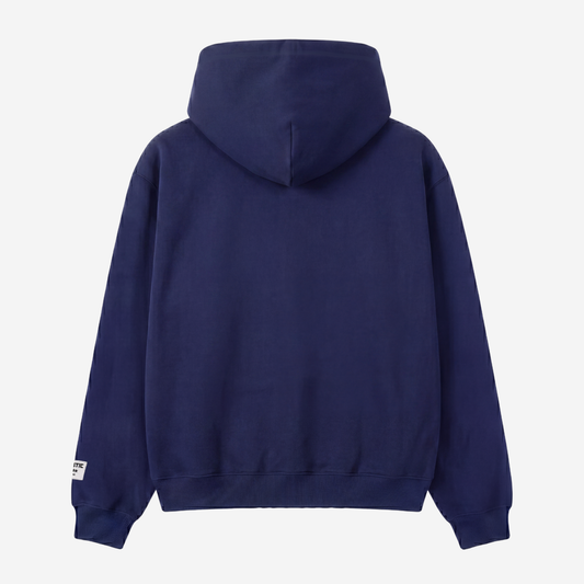 Back view of the CELESTIC Navy Blue Star Hoodie laid flat on a white background. Heavyweight navy blue cotton fleece pullover with a clean minimalist back, structured double-lined hood and ribbed cuffs and hem.