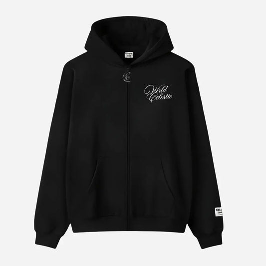 Front view of the CELESTIC Black Basic full-zip hoodie laid flat on a white background. Made from premium heavyweight black cotton fleece, it features white script logo embroidery on the chest, a custom silver metal 'C' zipper pull, and a woven brand patch on the left sleeve.