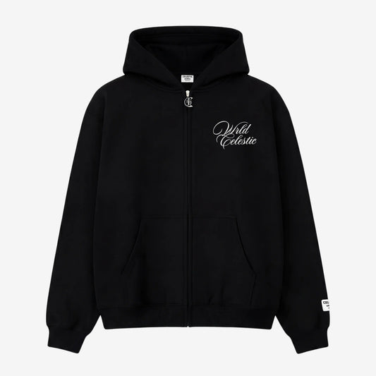 Front view of the CELESTIC Black Basic full-zip hoodie laid flat on a white background. Made from premium heavyweight black cotton fleece, it features white script logo embroidery on the chest, a custom silver metal 'C' zipper pull, and a woven brand patch on the left sleeve.