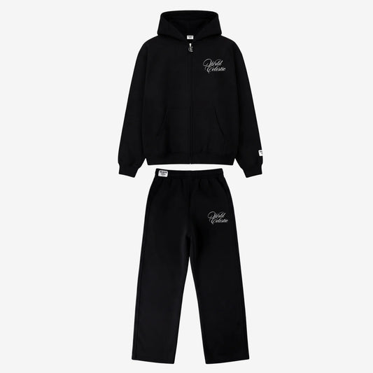 Main product image of the CELESTIC Black Basic Tracksuit set. This premium heavyweight black cotton fleece ensemble includes an oversized full-zip hoodie with white script logo embroidery on the chest, a custom metal 'C' zipper pull, and matching relaxed straight-leg sweatpants with thigh embroidery and a branded elastic waistband.