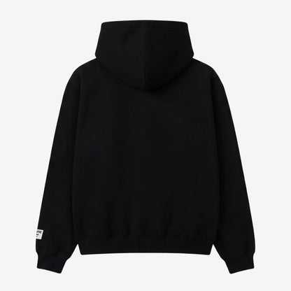 Black oversized zip-up hoodie back view laid flat on a white background. The premium heavyweight cotton fleece CELESTIC Black Outline Hoodie shows a clean, minimalist back with a structured double-lined hood and woven brand patches visible on the sleeves.