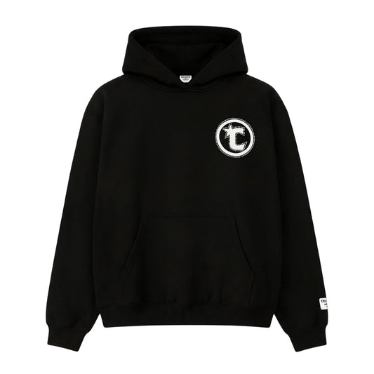 Front view flat-lay of the CELESTIC Black Star Hoodie on a white background. This premium heavyweight black cotton fleece pullover hoodie features a classic kangaroo pocket, structured hood, and ribbed cuffs and hem. The design is highlighted by a prominent white circular 'C' star logo embroidery on the left chest and a woven CELESTIC brand patch on the left sleeve cuff.