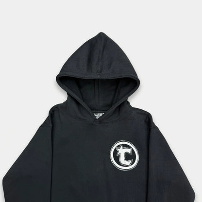 Detailed close-up of the CELESTIC Black Star hoodie upper section. Highlighting the premium heavyweight black cotton fleece fabric, the structured double-lined hood, and the prominent white circular 'C' star logo embroidery on the chest.