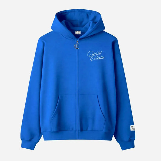 Blue oversized full-zip hoodie front view laid flat on a white background. The premium heavyweight cotton fleece CELESTIC Blue Basic Hoodie features white script logo embroidery on the left chest, a custom metal 'C' zipper pull, front pockets, and a woven brand patch on the left sleeve.