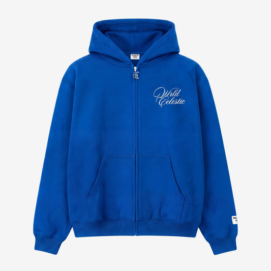 Blue oversized full-zip hoodie front view laid flat on a white background. The premium heavyweight cotton fleece CELESTIC Blue Basic Hoodie features white script logo embroidery on the left chest, a custom metal 'C' zipper pull, front pockets, and a woven brand patch on the left sleeve.