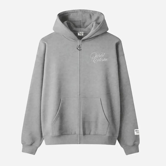 Front view of the CELESTIC Grey Basic full-zip hoodie laid flat on a white background. Made from premium heavyweight grey cotton fleece, it features white script logo embroidery on the chest, a custom metal 'C' zipper pull, and a woven brand patch on the left sleeve.