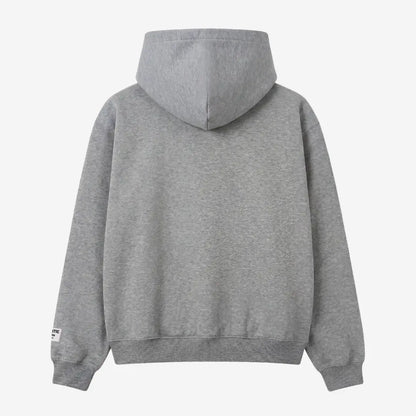 Back view of the CELESTIC Grey Basic zip-up hoodie laid flat on a white background. The premium heavyweight grey cotton fleece is shown with a structured double-lined hood and a clean minimalist back, featuring a woven brand patch on the left sleeve.
