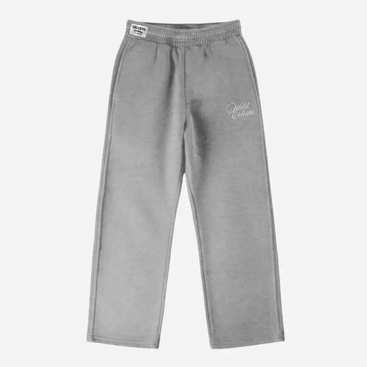 Front view of the CELESTIC Grey Basic sweatpants laid flat on a white background. These premium heavyweight grey cotton fleece pants feature a relaxed straight-leg fit, an elasticated waistband with a white woven brand label, and elegant white script logo embroidery on the left thigh.