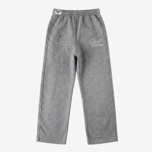 Front view of the CELESTIC Grey Basic sweatpants laid flat on a white background. These premium heavyweight grey cotton fleece pants feature a relaxed straight-leg fit, an elasticated waistband with a white woven brand label, and elegant white script logo embroidery on the left thigh.