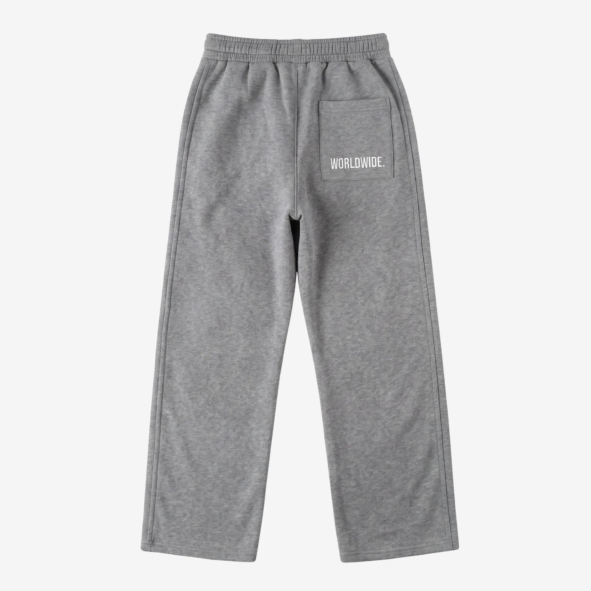 Back view of the CELESTIC Grey Basic sweatpants laid flat on a white background. These premium heavyweight grey cotton fleece pants feature a relaxed straight-leg silhouette and a back pocket with prominent white 'WORLDWIDE' logo embroidery.