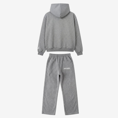 Back view of the full CELESTIC Grey Basic Tracksuit set laid flat on a white background. This premium heavyweight grey cotton fleece ensemble features an oversized zip-up hoodie with a structured hood and matching relaxed straight-leg sweatpants with white 'WORLDWIDE' embroidery on the back pocket.