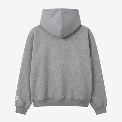 Back view flat-lay photograph of the CELESTIC Grey Gemstone Hoodie on a white background. This premium heather grey cotton fleece pullover features a clean, minimalist back design without graphics, a structured double-lined hood, and ribbed cuffs and hem. A distinct woven CELESTIC brand patch with white text is visible on the left sleeve cuff.