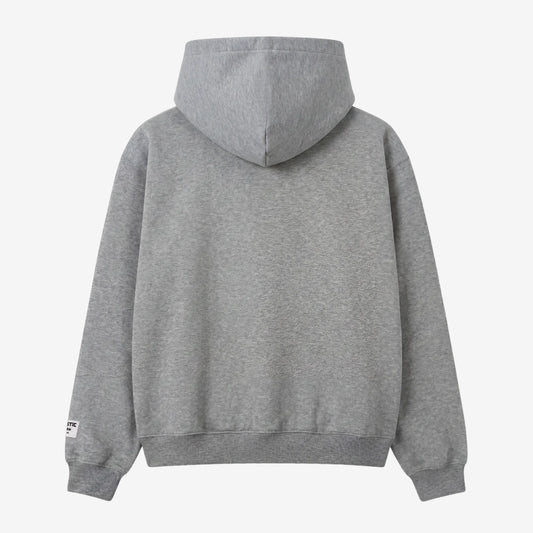 Back view flat-lay photograph of the CELESTIC Grey Gemstone Hoodie on a white background. This premium heather grey cotton fleece pullover features a clean, minimalist back design without graphics, a structured double-lined hood, and ribbed cuffs and hem. A distinct woven CELESTIC brand patch with white text is visible on the left sleeve cuff.