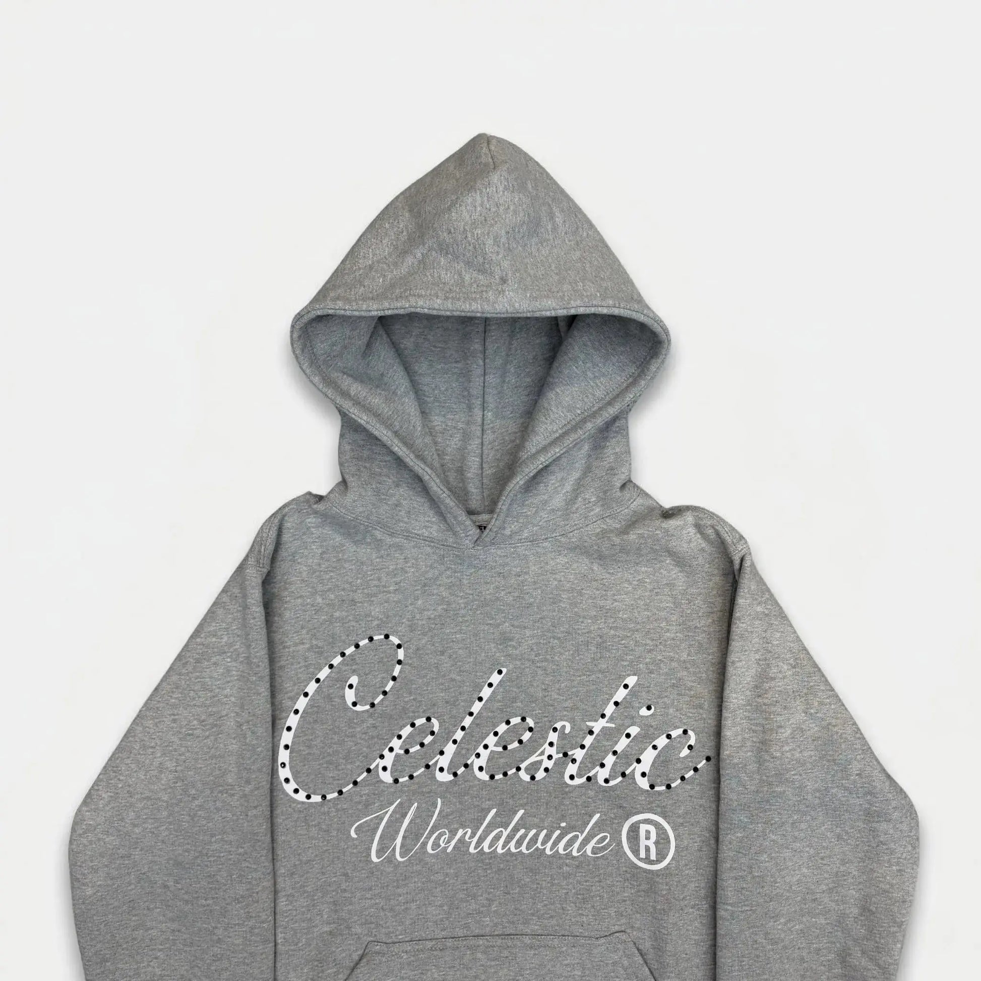 A detailed close-up flat-lay photograph of the upper section of the CELESTIC Grey Gemstone Hoodie on a white background. Highlighting the premium heather grey cotton fleece fabric and the structured double-lined hood. The chest features a large white screen-printed 'Celestic' script logo beautifully embellished with sparkling rhinestones, with the printed text 'Worldwide ®' situated underneath.