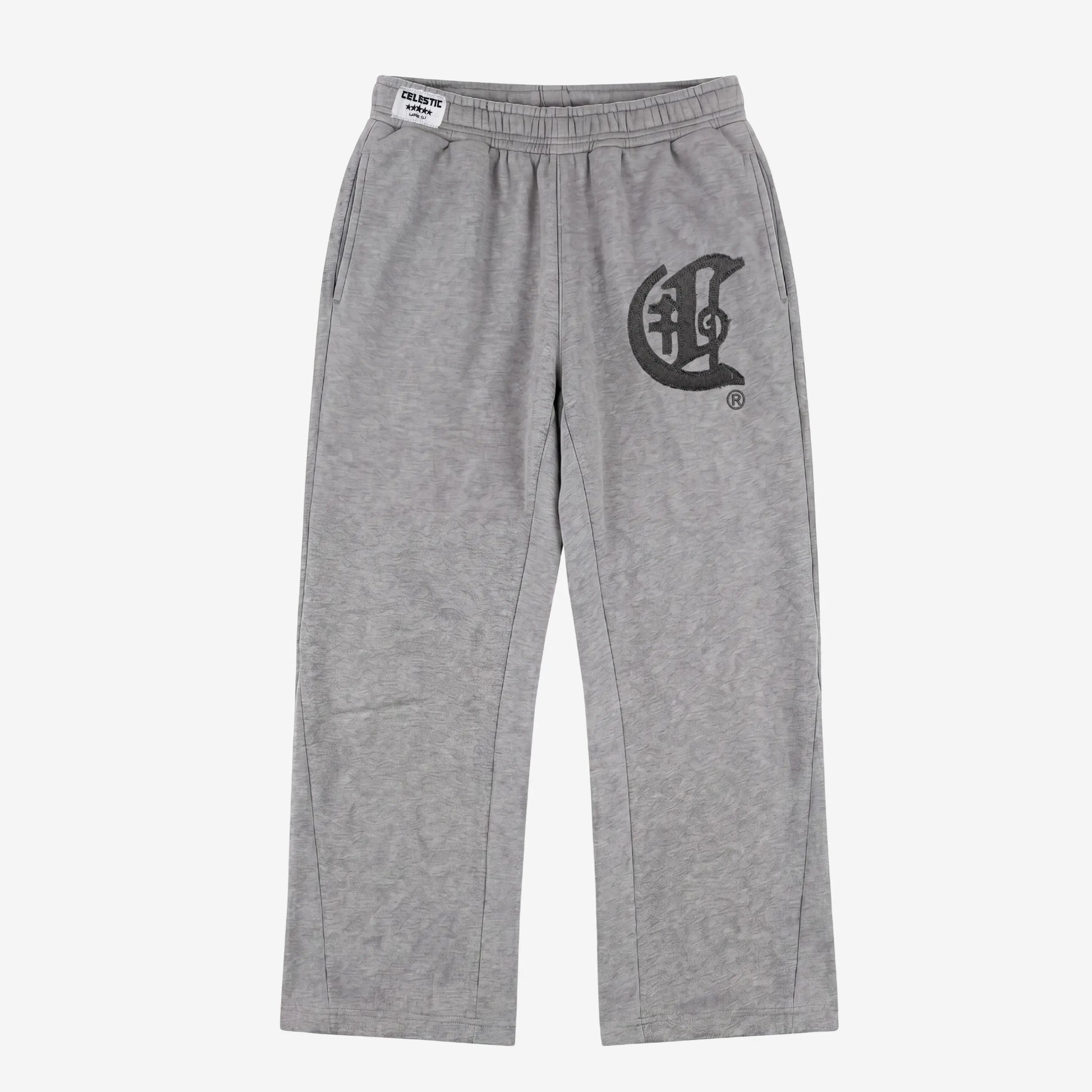 Front view flat-lay photograph of the CELESTIC Grey Zipper Flared Pants on a white background. These premium heather grey cotton fleece sweatpants feature a relaxed flared-leg fit, a comfortable elastic waistband, and side pockets. A large, prominent black gothic-style 'C' star logo is embroidered on the left thigh, and a white woven CELESTIC brand label is visible on the waistband.