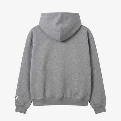Back view flat-lay photograph of the CELESTIC Grey Zipper Hoodie on a white background. This premium heather grey cotton fleece zip-up features a clean, minimalist back design, a structured double-lined hood, and ribbed cuffs and hem. A distinct white woven CELESTIC brand patch is visible on the left sleeve cuff.