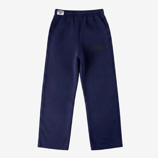 Navy blue oversized tracksuit sweatpants front view laid flat on a white background. The premium heavyweight cotton fleece CELESTIC Navy Blue Outline pants feature an elasticated ribbed waistband with a white woven brand label and tonal 'Celestic' outline logo embroidery on the left thigh.