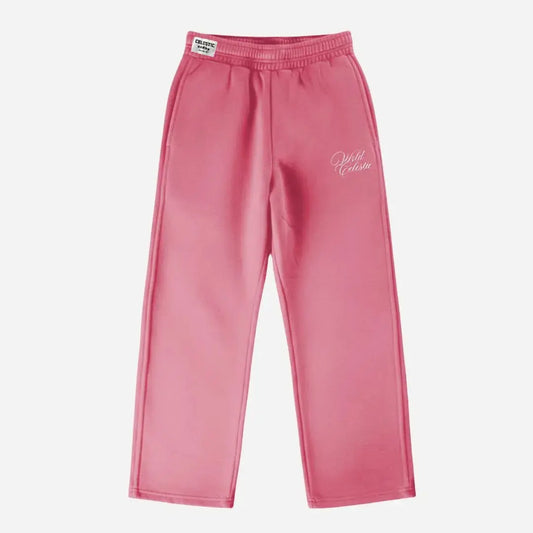 Pink oversized tracksuit sweatpants front view laid flat on a white background. The premium heavyweight cotton fleece CELESTIC Pink Basic pants feature an elasticated ribbed waistband with a woven brand label, prominent side seams, and elegant white script logo embroidery on the left thigh.