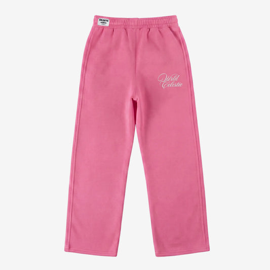 Pink oversized tracksuit sweatpants front view laid flat on a white background. The premium heavyweight cotton fleece CELESTIC Pink Basic pants feature an elasticated ribbed waistband with a woven brand label, prominent side seams, and elegant white script logo embroidery on the left thigh.