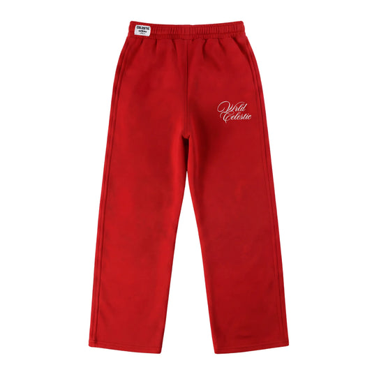 Red oversized tracksuit sweatpants front view laid flat on a white background. The premium heavyweight cotton fleece CELESTIC Red Basic pants feature an elasticated ribbed waistband with a woven brand label, prominent side panel seams, and elegant white script logo embroidery on the left thigh.