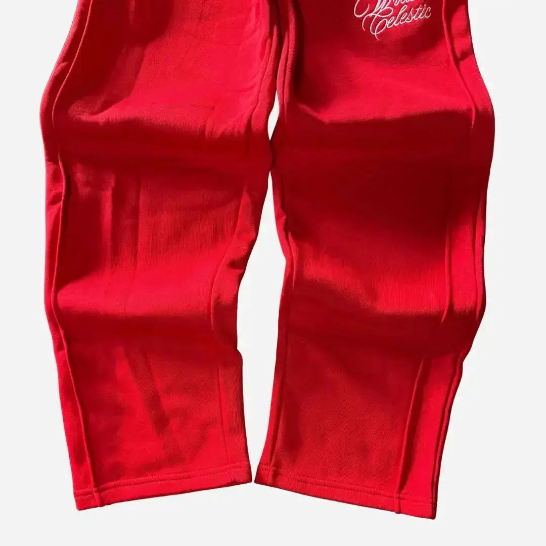 Detailed close-up of the lower legs and hems of the CELESTIC Red Basic sweatpants. Highlighting the relaxed straight fit with an open hem, prominent side panel seams, and the premium heavyweight red cotton fleece fabric.