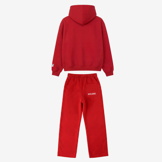 Back view of the CELESTIC Red Basic Tracksuit laid flat on a white background. Premium heavyweight red cotton fleece set showing a clean minimalist hoodie back, structured hood, and matching sweatpants featuring white 'WORLDWIDE' embroidery on the back pocket.