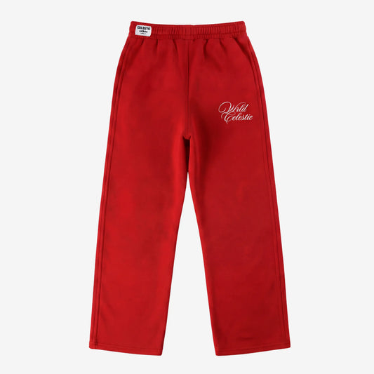 Red oversized tracksuit sweatpants front view laid flat on a white background. The premium heavyweight cotton fleece CELESTIC Red Basic pants feature an elasticated ribbed waistband with a woven brand label, prominent side panel seams, and elegant white script logo embroidery on the left thigh.