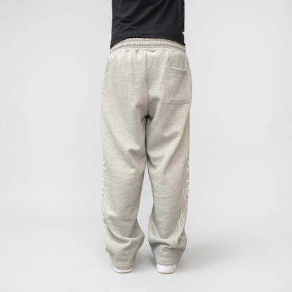 On-model view of the CELESTIC Grey Script Pants showing the relaxed straight-leg fit in heavyweight heather grey cotton fleece.