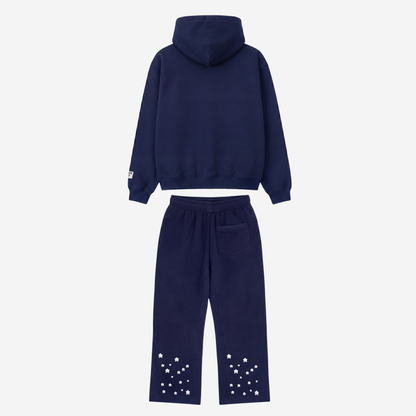 Back view of the CELESTIC Navy Blue Star Tracksuit laid flat on a white background. Heavyweight navy blue cotton fleece pullover hoodie with structured hood and matching flared pants with embroidered stars around the leg openings.